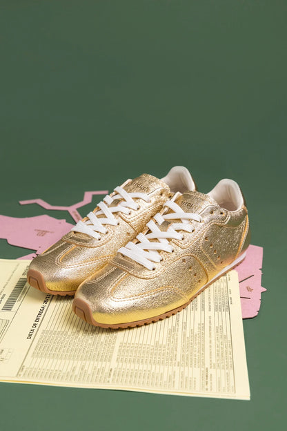 Stella Sneaker In Gold Metallic Leather