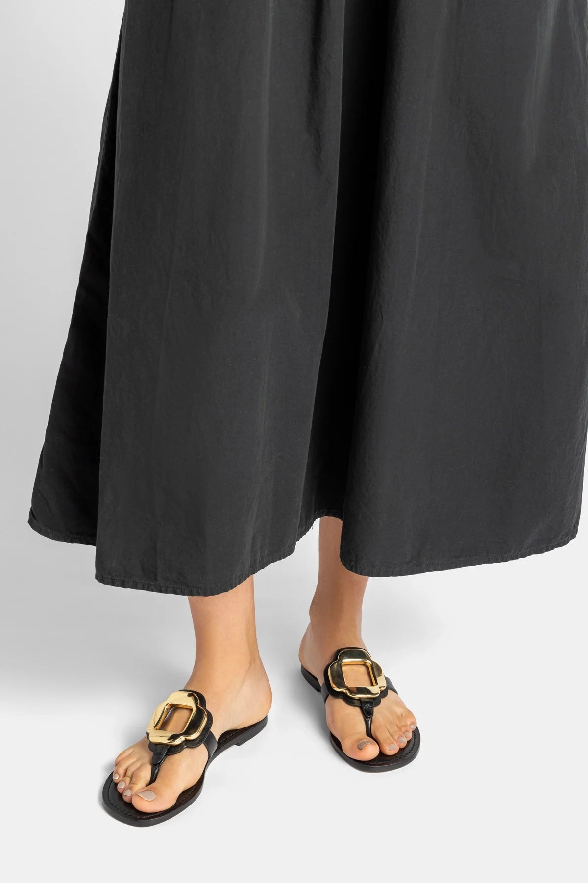 Margherita Thong Sandal in Black Leather and Gold Hardware